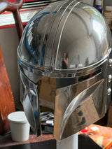 The Mandalorian helmet is painted with electroplated silver paints. It's strong and durable. 